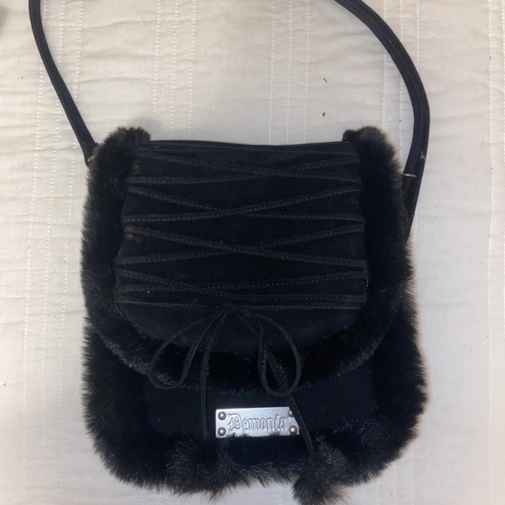 black fur silver hardware demonia shoulder bag